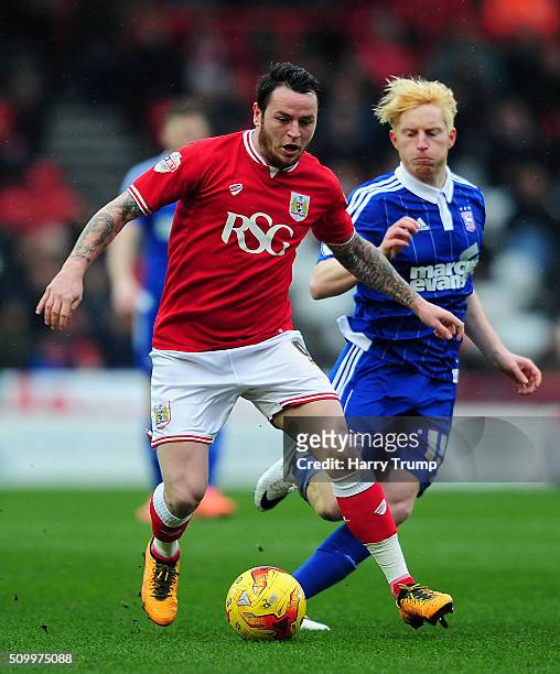 Lee Tomlin of Bristol City is tackled by Ben Pringle of Ipswich Town during the Sky Bet Championship match between Bristol City and Ipswich Town at...