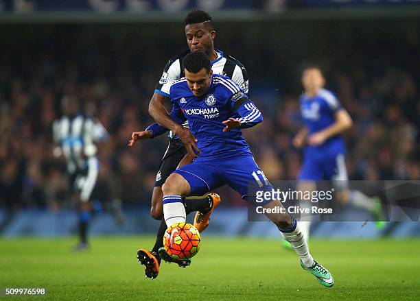 Pedro of Chelsea controls the ball under pressure of Rolando Aarons of Newcastle United during the Barclays Premier League match between Chelsea and...