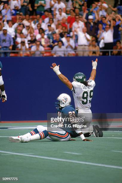 Defensive end Mark Gastineau of the New York Jets celebrates after a play during the game against the Miami Dolphins in 1986 at Giants Stadium in the...