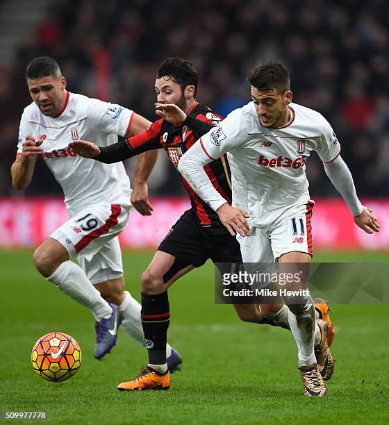 Joselu of Stoke City and Adam Smith of Bournemouth compete for the ball during the Barclays Premier League match between A.F.C. Bournemouth and Stoke...