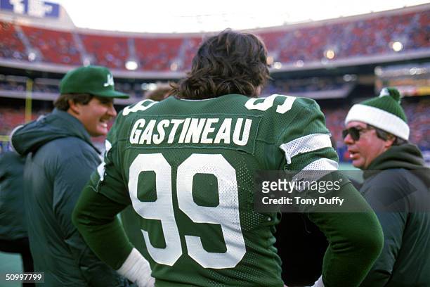 Back view of defensive end Mark Gastineau of the New York Jets as he looks on from the sidelines during a game in 1984.
