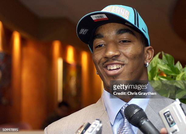 Smith, the 18th pick in the 2004 NBA Draft first round for the New Orleans Hornets, talks with reporters after a press conference on June 25, 2004 at...