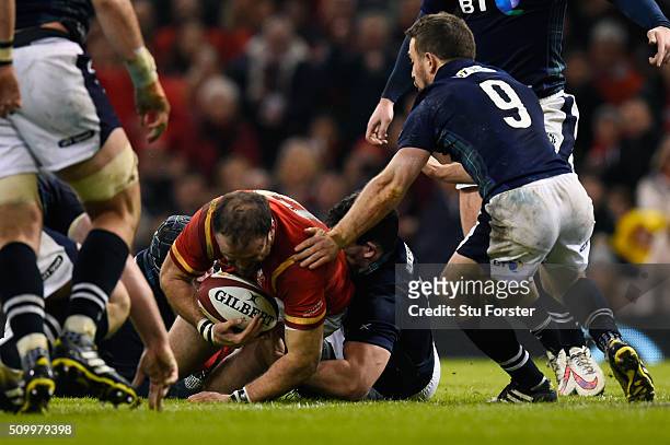 Jamie Roberts of Wales barges over to score his team's second try during the RBS Six Nations match between Wales and Scotland at the Principality...