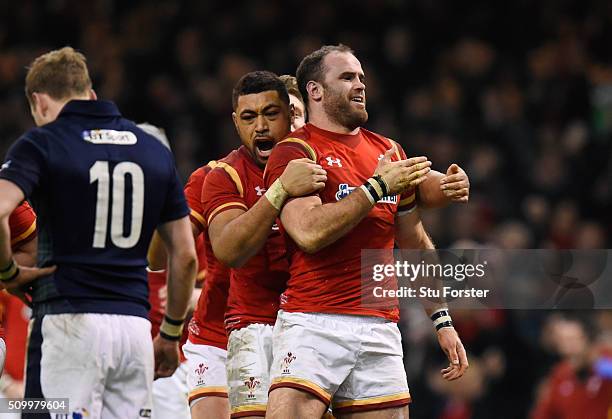 Jamie Roberts of Wales is congratulated by teammate Taulupe Faletau of Wales after scoring his team's second try during the RBS Six Nations match...