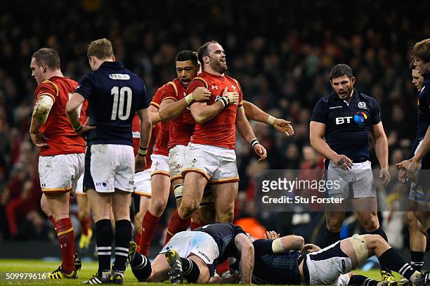 Jamie Roberts of Wales is congratulated by teammate Taulupe Faletau of Wales after scoring his team's second try during the RBS Six Nations match...