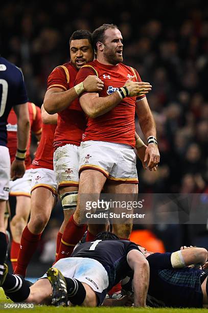 Jamie Roberts of Wales is congratulated by teammate Taulupe Faletau of Wales after scoring his team's second try during the RBS Six Nations match...