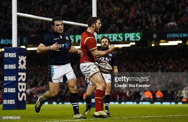 George North of Wales celebrates after scoring his team's third try during the RBS Six Nations match between Wales and Scotland at the Principality...
