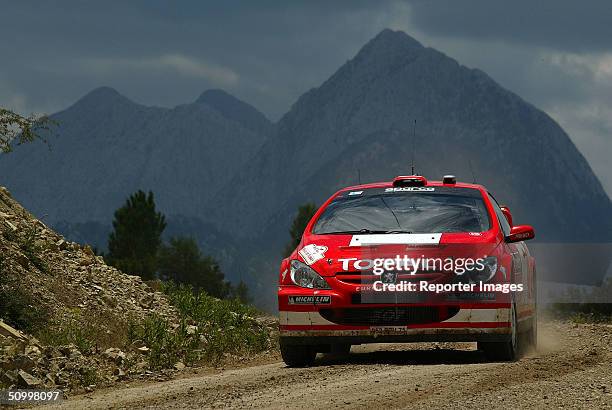 Marcus Gronholm and Timo Rautiainen of Finland drive their Peugeot 307 WRC, Marlboro Peugeot Total, A/8 during the Rally of Turkey 2004, Leg 1 on...