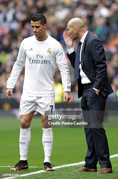 Real Madrid 's coach Zinedine Zidane gives instructions to his player Cristiano Ronaldo during the La Liga match between Real Madrid CF and Athletic...