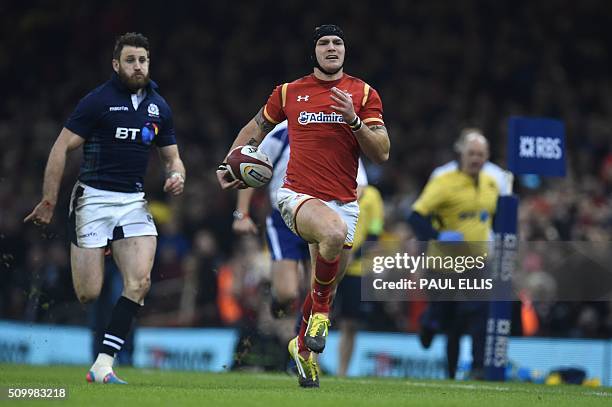 Scotland's wing Tommy Seymour chases Wales' wing Tom James during the Six Nations international rugby union match between Wales and Scotland at the...