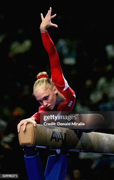 Courtney McCool competes on the balance beam during the Women's preliminaries of the U.S. Gymnastics Olympic Team Trials on June 25, 2004 at The...