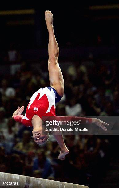 Courtney McCool competes on the balance beam during the Women's preliminaries of the U.S. Gymnastics Olympic Team Trials on June 25, 2004 at The...