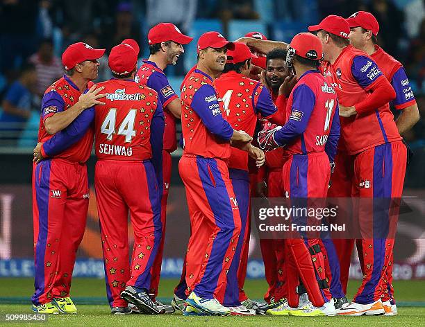 Muttiah Muralitharan of Gemini Arabians celebrates the wicket of Scott Styris of Leo Lions with his team-mates during the Final match of the Oxigen...