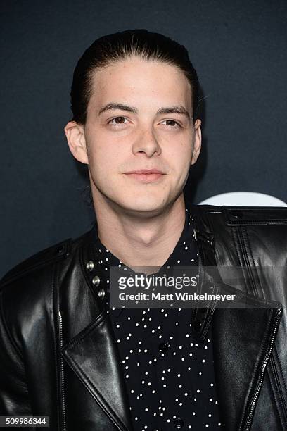 Actor Israel Broussard arrives at the Saint Laurent show at the Hollywood Palladium on February 10, 2016 in Los Angeles, California.