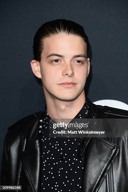 Actor Israel Broussard arrives at the Saint Laurent show at the Hollywood Palladium on February 10, 2016 in Los Angeles, California.