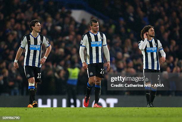 Dejected looking Daryl Janmaat, Steven Taylor and Fabrizio Coloccini of Newcastle United during the Barclays Premier League match between Chelsea and...