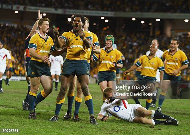 Lote Tuqiri, the Australian wing, celebrates after scoring a try during the rugby union international match between the Australian Wallabies and...