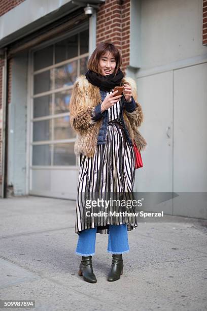 Hyojung Uyoo is seen at Jill Stuart wearing a Mcginn fur coat, Jill Stuart dress, Korean national brand shoes, Stella Mccartney pants, and Celine bag...