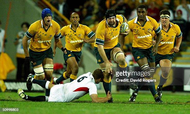 David Lyons, the Australian number eight powers forward during the rugby union international match between the Australian Wallabies and England for...