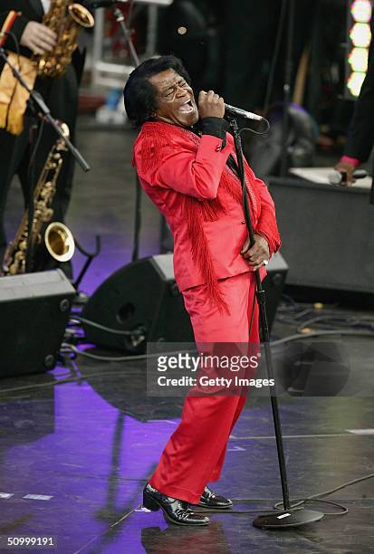Singer James Brown performs on stage at the Olympic Torch Concert held in The Mall on June 26, 2004 in London. The free concert - organised by Visit...