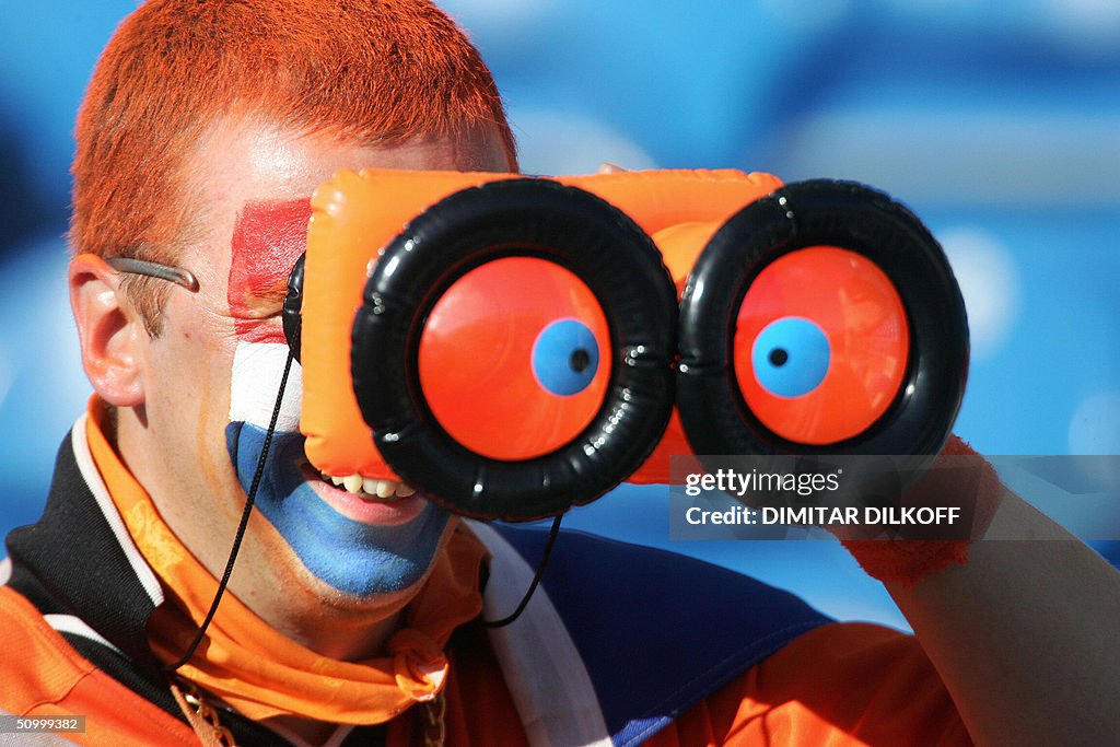 A Dutch supporter waits for the beginnin