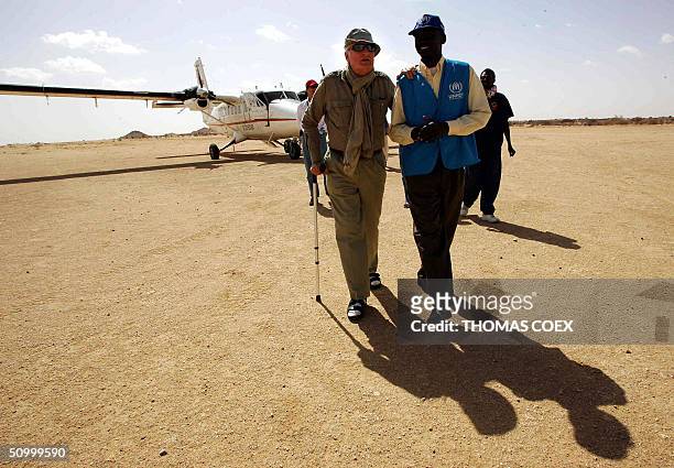 Former French Foreign minister and NGO Care-France president Jean-Francois Deniau is welcomed by UNHCR official during his visit at the Iridimi's...