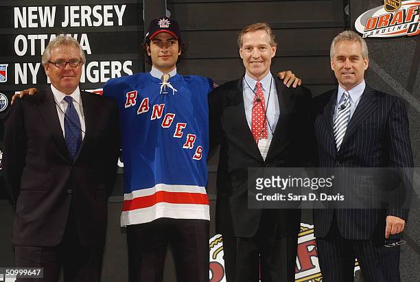 Tom Renney, #6 overall draft pick Al Montoya, assistant GM Don Maloney and general manager Glen Sather of the New York Rangers pose during the 2004...