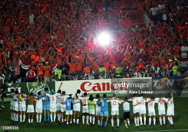 Holland celebrate with their fans after defeating Sweden in the penalty shoot out during the UEFA Euro 2004, Quarter Final match between Sweden and...