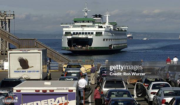 Washington State ferry pulls into Colman dock on June 26, 2004 in Seattle, Washington. Random searches of cars recently started again after being...