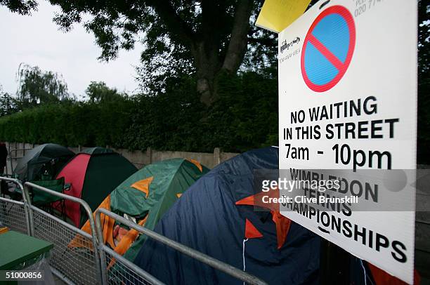 Fans camp out overnight in the queue for middle Saturday at the Wimbledon Lawn Tennis Championship on June 26, 2004 at the All England Lawn Tennis...