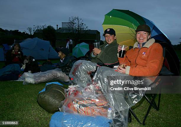 Fans camp out overnight in the queue for middle Saturday at the Wimbledon Lawn Tennis Championship on June 26, 2004 at the All England Lawn Tennis...