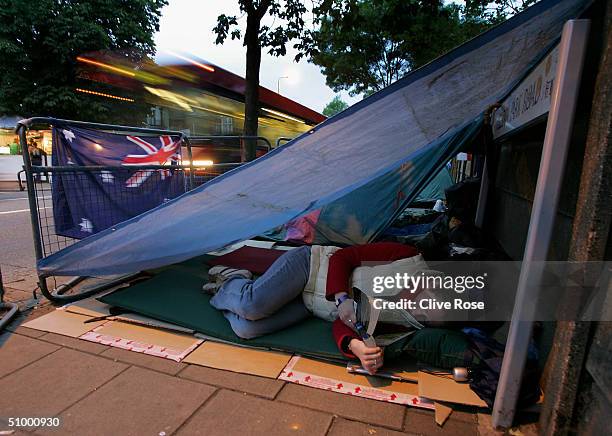 Fans camp out overnight in the queue for middle Saturday at the Wimbledon Lawn Tennis Championship on June 26, 2004 at the All England Lawn Tennis...