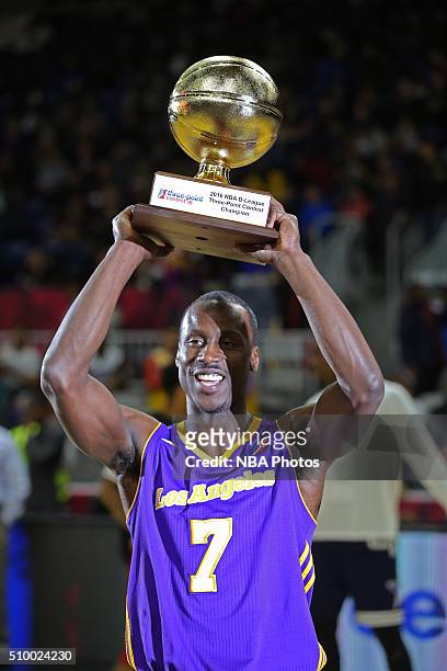 Andre Ingram of the Los Angeles D-Fenders holds up the trophy after he wins the NBA D-League All-Star 3 Point Contest, presented by Kumho Tire, as...