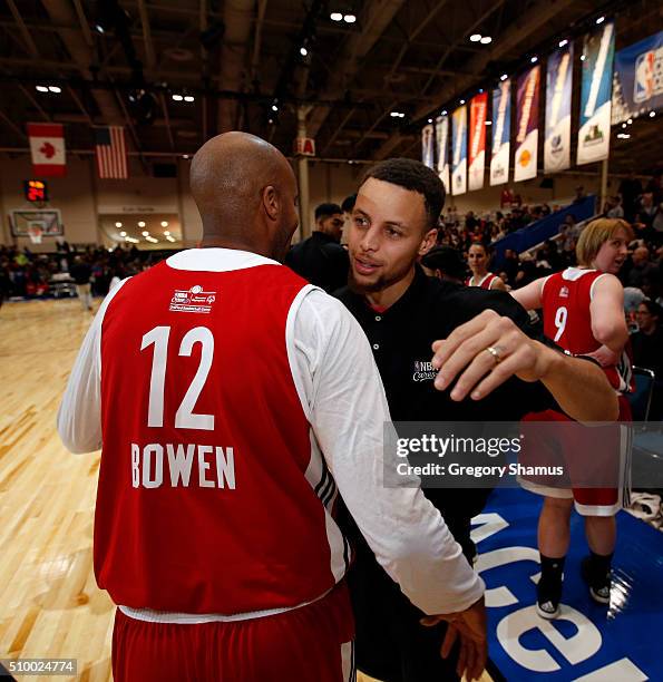 Stephen Curry of the Golden State Warriors hugs NBA Legend Bruce Bowen during the NBA Cares Special Olympics Unified Game as part of 2016 All-Star...