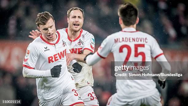 Yannick Gerhardt of Koeln celebrates his team's first goal with his team mates Filip Mladenovic and Matthias Lehmann during the Bundesliga match...