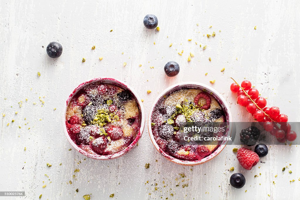 Berries soufflé on wooden board served as dessert