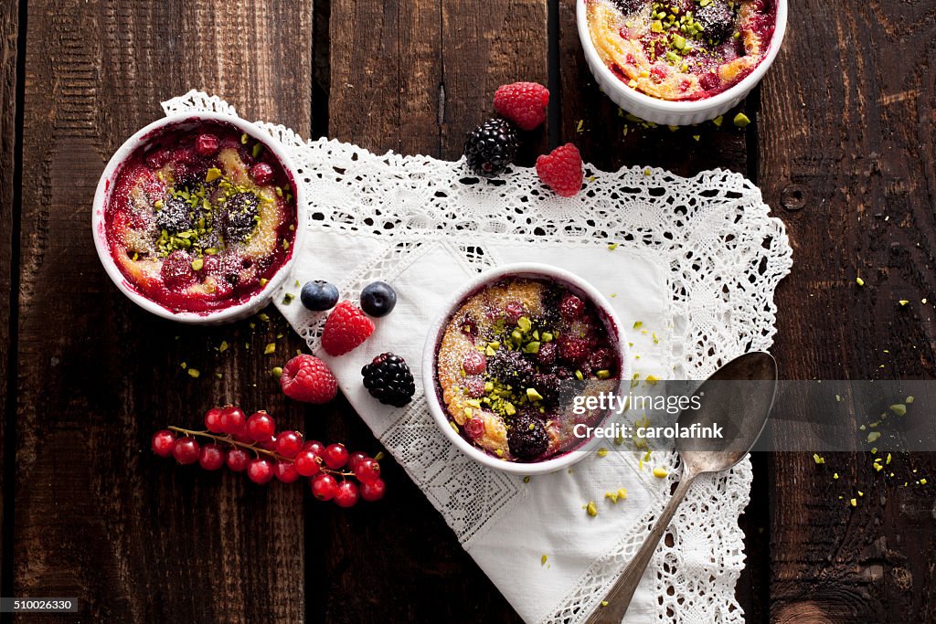 Berries soufflé on wooden board served as dessert