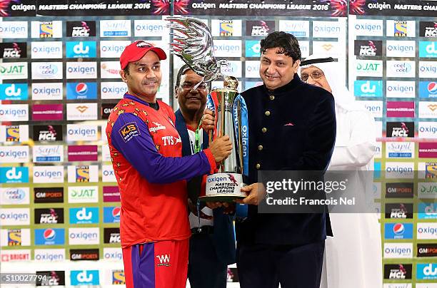 Virender Sehwag of Gemini Arabians receives the trophy following his team's victory at the end of the Final match of the Oxigen Masters Champions...