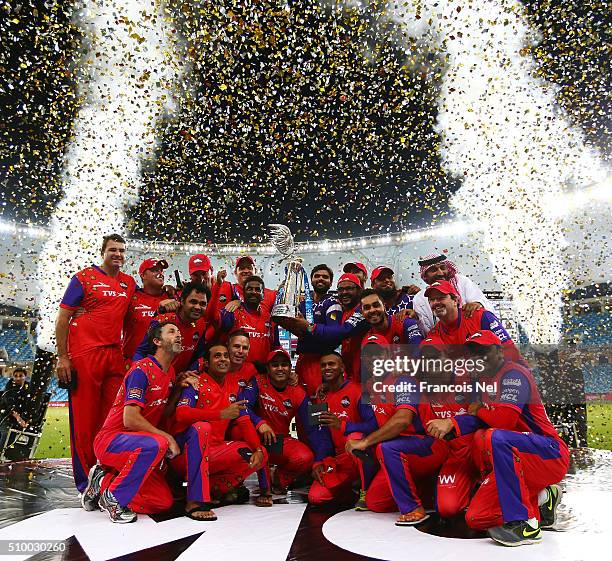 The Gemini Arabians players and staff celebrate with the trophy following their victory at the end of the Final match of the Oxigen Masters Champions...