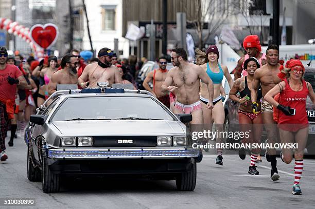 People run in "Cupid's Undie Run" to raise money for charity on February 13, 2016 in Washington, DC. Participants run in their Valentine's-themed...