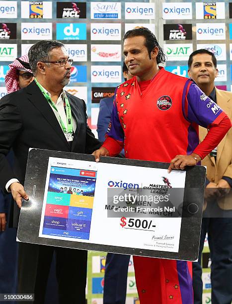 Naved-ul-Hasan of Gemini Arabians receives the Man of the Match award after the Final match of the Oxigen Masters Champions League between Gemini...