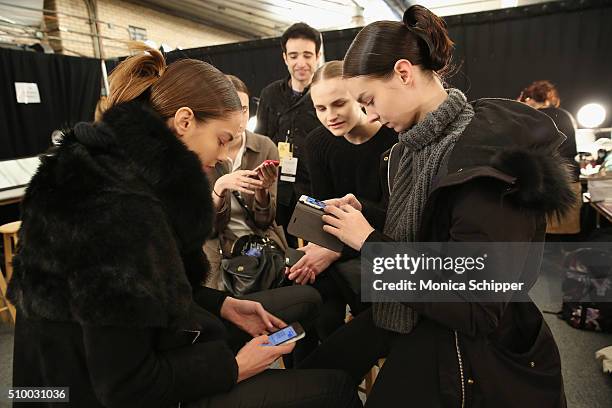 Models prepare backstage at the Son Jung Wan Fall 2016 fashion show during New York Fashion Week: The Shows at The Dock, Skylight at Moynihan Station...