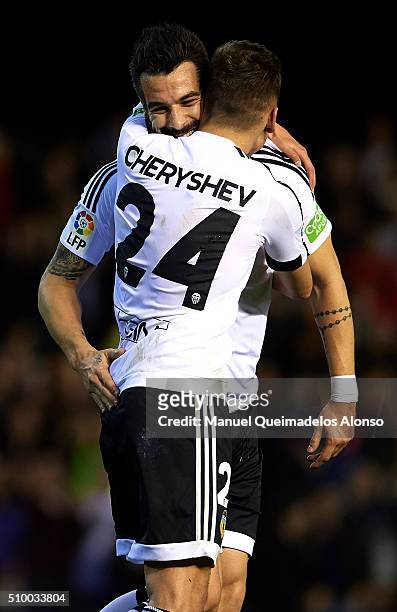 Denis Cheryshev of Valencia celebrates scoring his team's second goal with his teammate Alvaro Negredo during the La Liga match between Valencia CF...