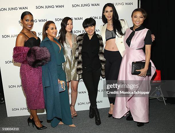 Vicky Jeudy, Adrienne Bailon, Arden Cho, Son Jung Wan, Carmen Carrera, and Jeannie Mai pose backstage at Son Jung Wan Fall 2016 fashion show during...