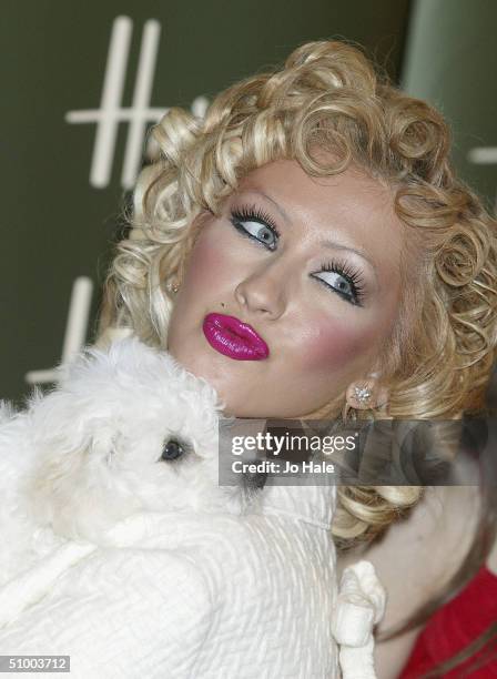 Pop star Christina Aguilera officially opens the Harrods Summer sale on June 28, 2004 at the Knightsbridge store, in London.