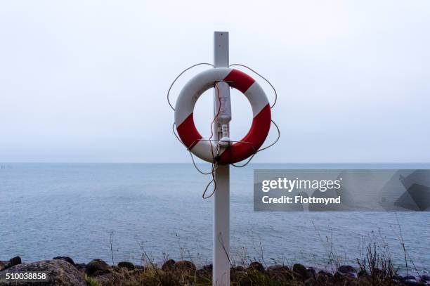 rescue buoy - reddingsboei stock pictures, royalty-free photos & images