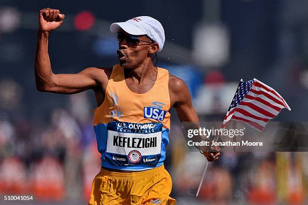 Meb Keflezighi celebrates as he approaches the finish line to take second place during the U.S Olympic Marathon Team Trials on February 13, 2016 in...