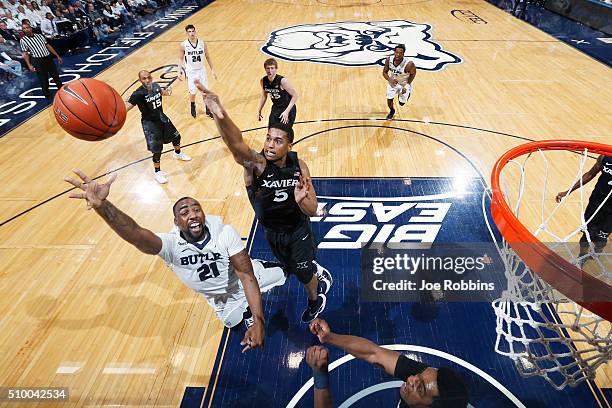 Trevon Bluiett of the Xavier Musketeers defends against Roosevelt Jones of the Butler Bulldogs in the first half of the game at Hinkle Fieldhouse on...