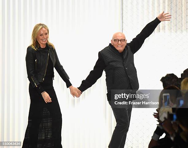 Lubov Azria and Max Azria pose on the runway wearing Herve Leger By Max Azria Fall 2016 during New York Fashion Week: The Shows at The Arc, Skylight...