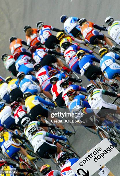 File picture taken 12 October 2002, showing pack of riders on the Zolder motor circuit riding below a placard reading as " Doping Control " during...